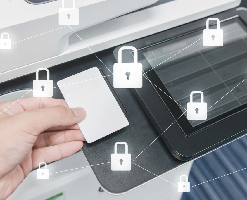 Person holding key card to printer chip