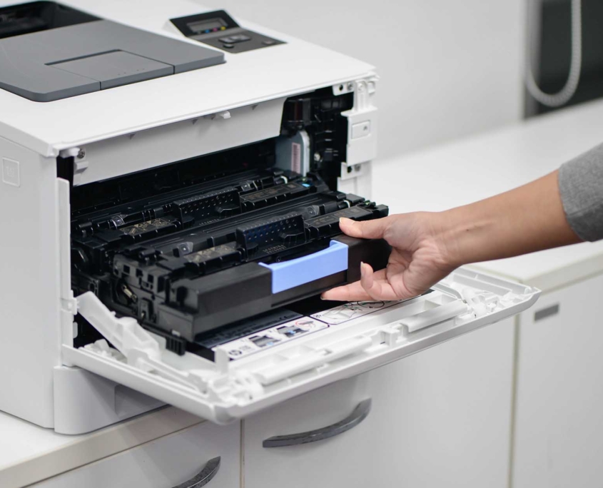 View of a person changing the toner in a printer