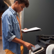 View of an office worker printing a file