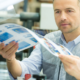 manager examining proofs from print production